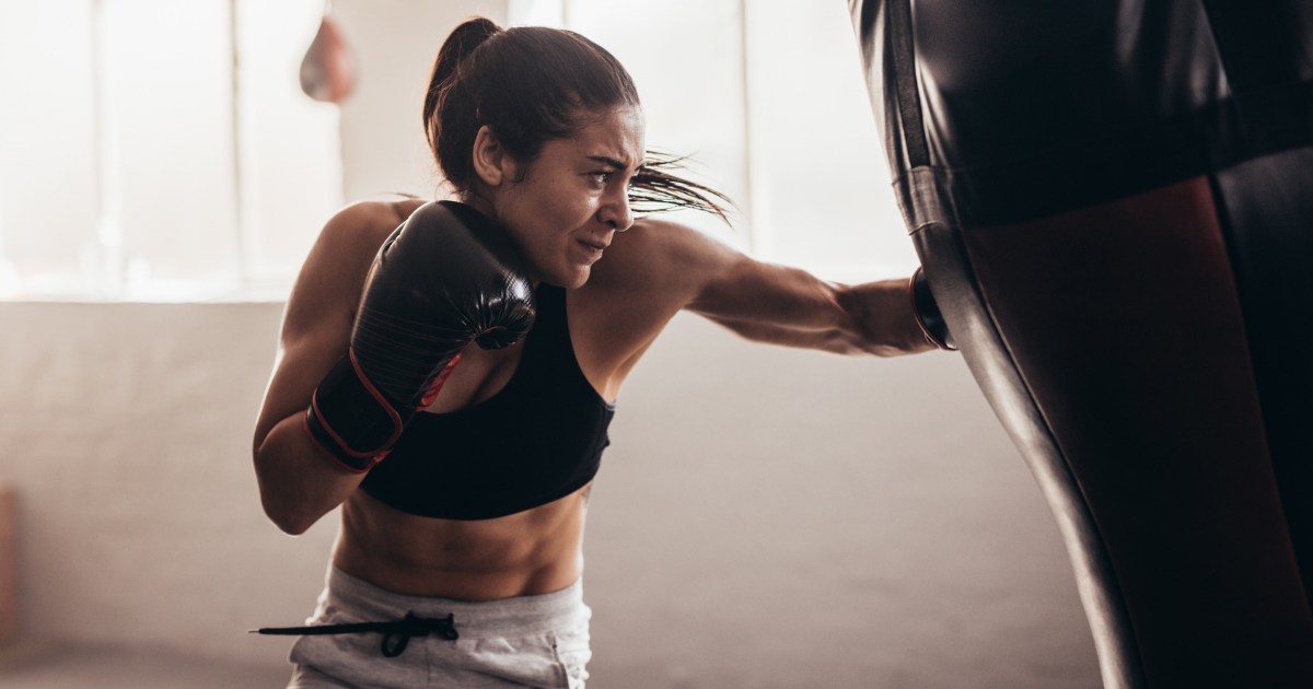 anxious athlete punching a punch bag