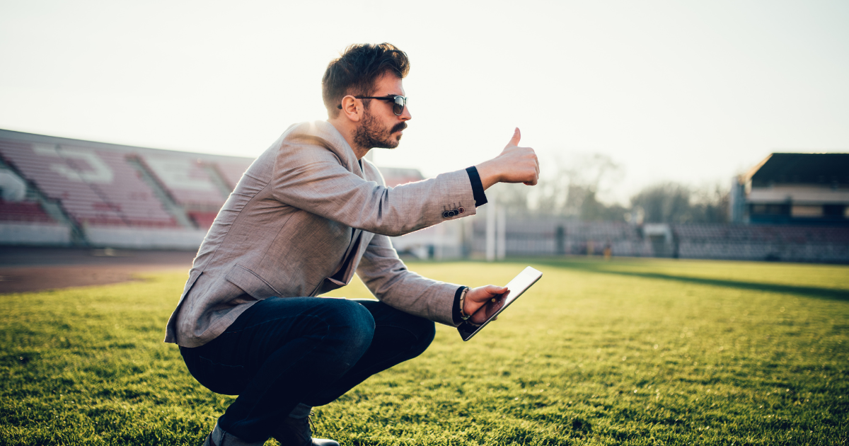 Sports governance member on football pitch with a focus of diversity