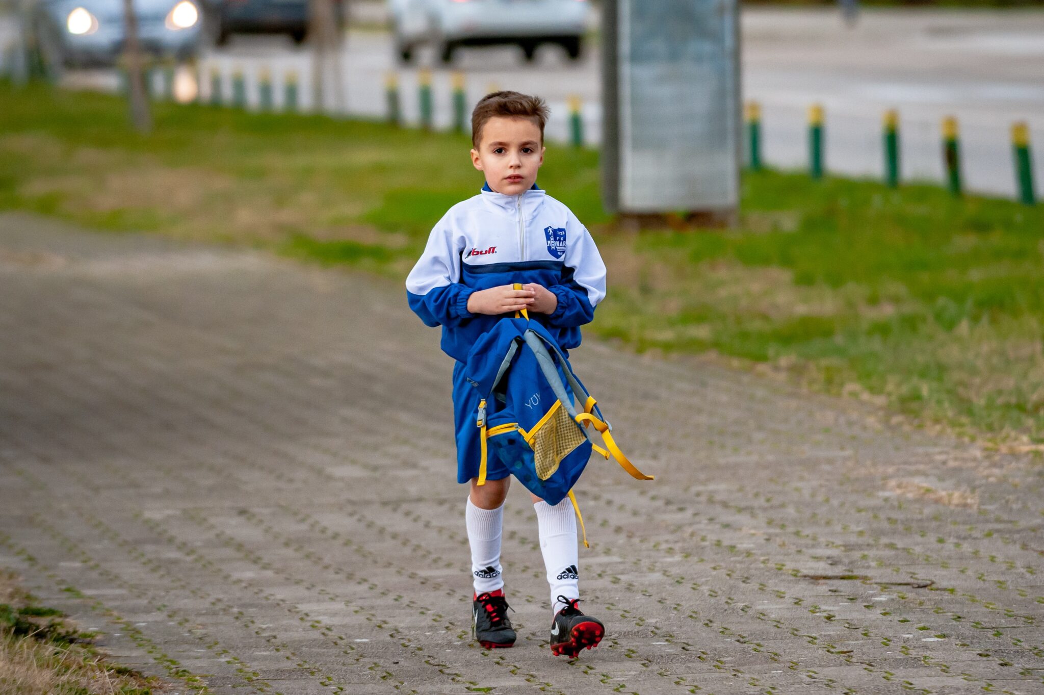 child wearing football kit alone